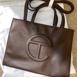 Brand New telfar medium chocolate. Tags are attached to bag. Comes with dust bag